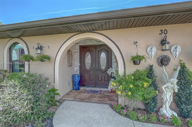 30 Bunker Ln Fl, Grove City-Rotonda, FL 33947 - doorway to property featuring stucco siding