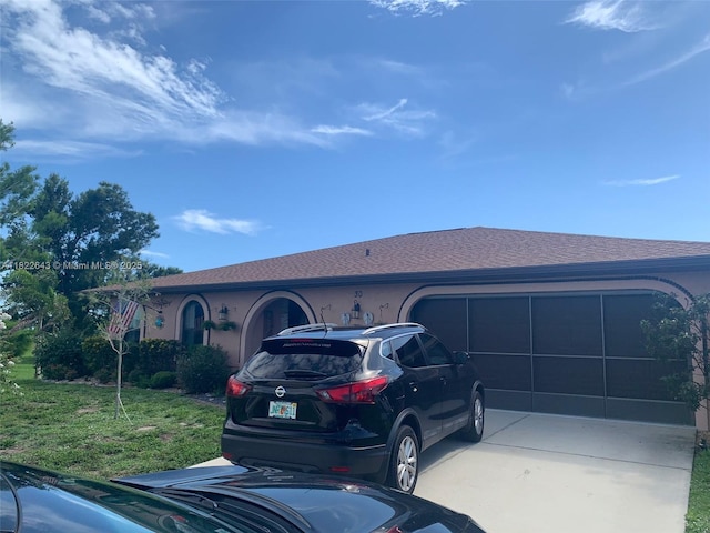 30 Bunker Ln Fl, Grove City-Rotonda, FL 33947 - view of front of property featuring driveway, a garage, a front yard, roof with shingles, and stucco siding