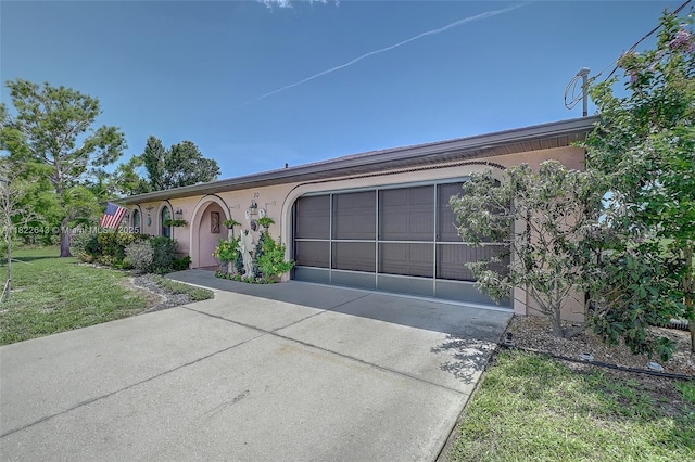 30 Bunker Ln Fl, Grove City-Rotonda, FL 33947 - single story home featuring concrete driveway, a garage, stucco siding, and a front lawn