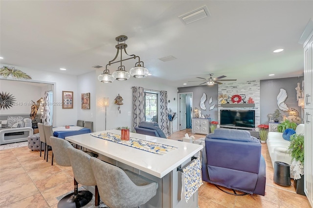 30 Bunker Ln Fl, Grove City-Rotonda, FL 33947 - kitchen featuring open floor plan, light countertops, a center island, a ceiling fan, and recessed lighting