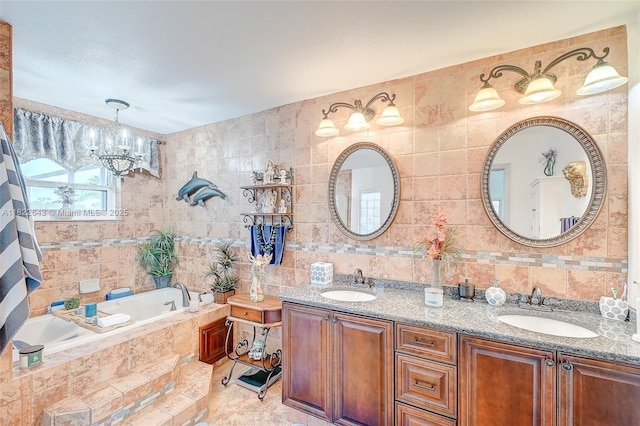 30 Bunker Ln Fl, Grove City-Rotonda, FL 33947 - bathroom featuring tile walls, a chandelier, double vanity, a garden tub, and decorative backsplash