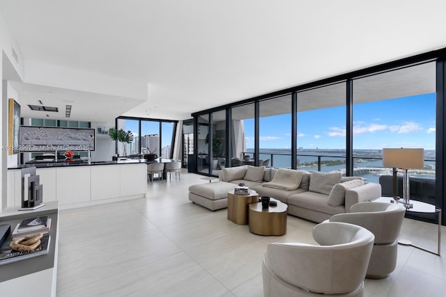 1000 Biscayne Blvd Unit 3402, Miami, FL 33132 - living room with a wall of windows, a water view, light tile patterned floors, and plenty of natural light