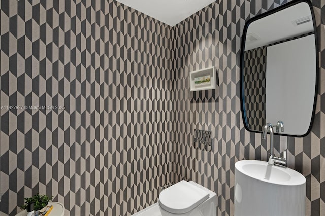 1000 Biscayne Blvd Unit 3402, Miami, FL 33132 - bathroom with wallpapered walls and toilet