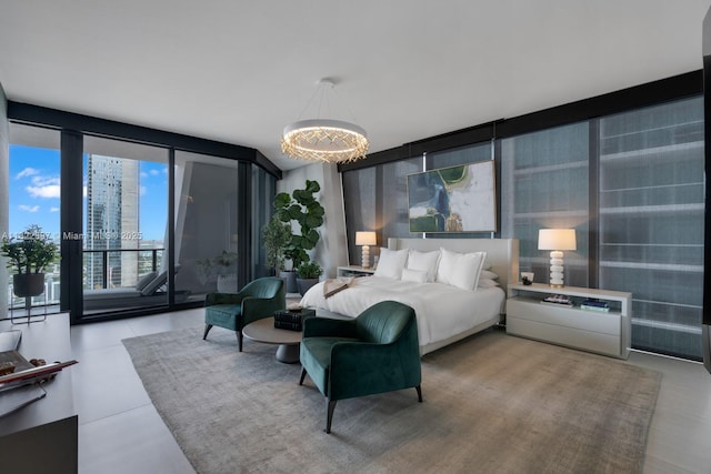 1000 Biscayne Blvd Unit 3402, Miami, FL 33132 - bedroom with a wall of windows, access to outside, and a chandelier