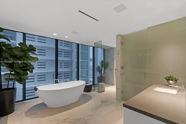 1000 Biscayne Blvd Unit 3402, Miami, FL 33132 - full bathroom with vanity, a soaking tub, a shower stall, marble tiled flooring, and plenty of natural light