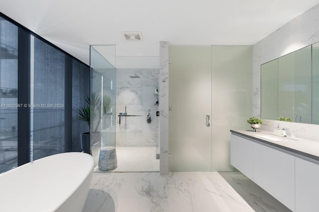 1000 Biscayne Blvd Unit 3402, Miami, FL 33132 - bathroom with vanity, a marble finish shower, a soaking tub, and marble tiled floors