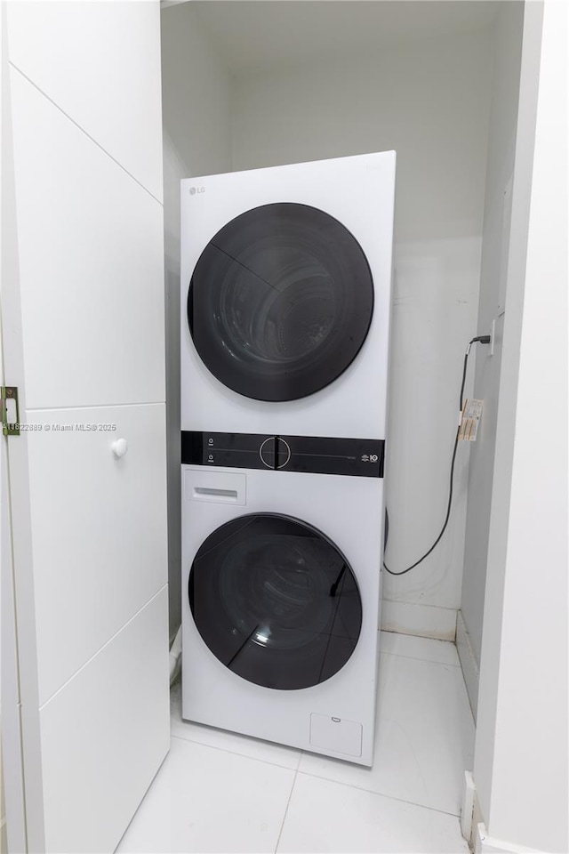 900 Biscayne Blvd Unit 2210, Miami, FL 33132 - laundry area with stacked washer / dryer and tile patterned floors