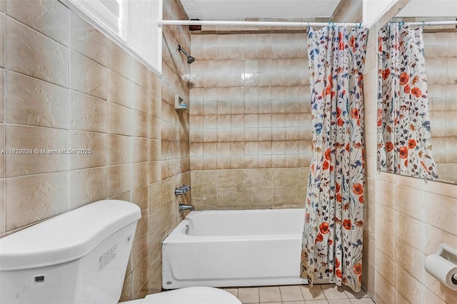 19801 NE 1st Ave, Miami, FL 33179 - bathroom featuring shower / bathtub combination with curtain, tile patterned flooring, and tile walls