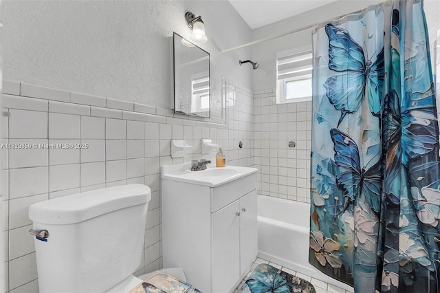19801 NE 1st Ave, Miami, FL 33179 - bathroom featuring shower / tub combo, vanity, and tile walls