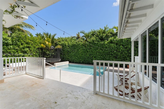 220 Cypress Dr, Key Biscayne, FL 33149 - view of swimming pool with a patio area