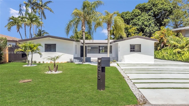 2413 Gulfstream Ln, Fort Lauderdale, FL 33312 - single story home featuring stucco siding and a front lawn