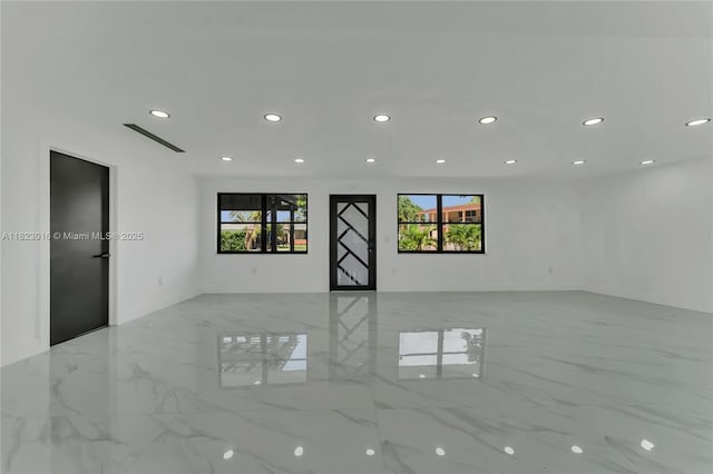 2413 Gulfstream Ln, Fort Lauderdale, FL 33312 - empty room featuring plenty of natural light, recessed lighting, and marble tiled flooring