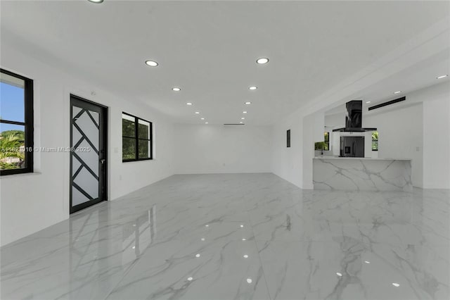 2413 Gulfstream Ln, Fort Lauderdale, FL 33312 - unfurnished living room featuring recessed lighting and marble finish flooring