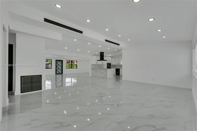 2413 Gulfstream Ln, Fort Lauderdale, FL 33312 - unfurnished living room with recessed lighting and light marble finish floors
