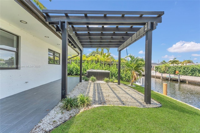 2413 Gulfstream Ln, Fort Lauderdale, FL 33312 - view of green lawn with a water view, a pergola, a jacuzzi, and a patio area