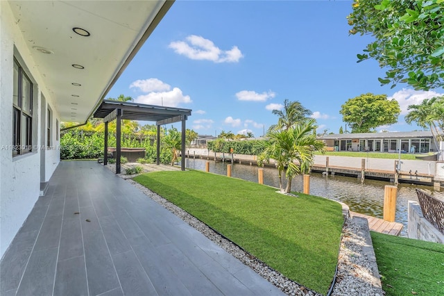 2413 Gulfstream Ln, Fort Lauderdale, FL 33312 - view of green lawn with a water view, a dock, a patio area, and a covered hot tub