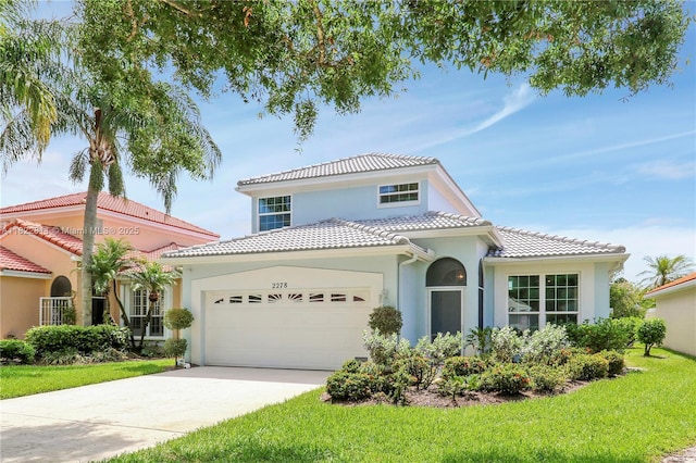 2278 SW Olympic Club Ter, Palm City, FL 34990 - mediterranean / spanish-style home with stucco siding, a garage, a tiled roof, driveway, and a front yard