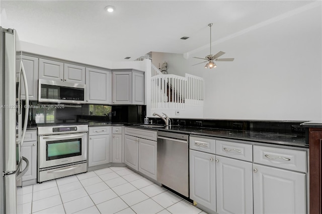 2278 SW Olympic Club Ter, Palm City, FL 34990 - kitchen featuring appliances with stainless steel finishes, ceiling fan, lofted ceiling, and light tile patterned floors