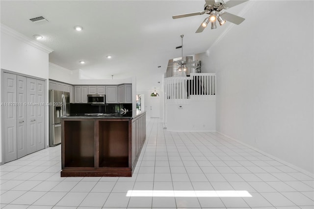 2278 SW Olympic Club Ter, Palm City, FL 34990 - kitchen with appliances with stainless steel finishes, a ceiling fan, ornamental molding, gray cabinets, and dark countertops