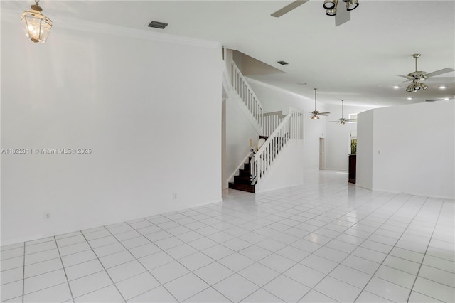 2278 SW Olympic Club Ter, Palm City, FL 34990 - unfurnished room featuring a ceiling fan, stairs, light tile patterned floors, and crown molding
