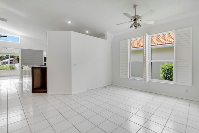 2278 SW Olympic Club Ter, Palm City, FL 34990 - empty room featuring ceiling fan, crown molding, vaulted ceiling, light tile patterned floors, and a textured ceiling