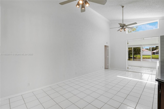 2278 SW Olympic Club Ter, Palm City, FL 34990 - empty room featuring a ceiling fan, ornamental molding, high vaulted ceiling, light tile patterned floors, and a textured ceiling