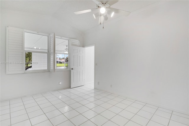 2278 SW Olympic Club Ter, Palm City, FL 34990 - spare room featuring crown molding, vaulted ceiling, a ceiling fan, and light tile patterned flooring