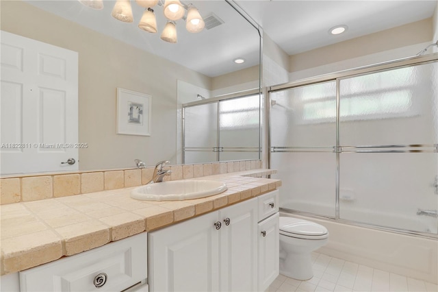 2278 SW Olympic Club Ter, Palm City, FL 34990 - bathroom featuring vanity, enclosed tub / shower combo, and tile patterned floors