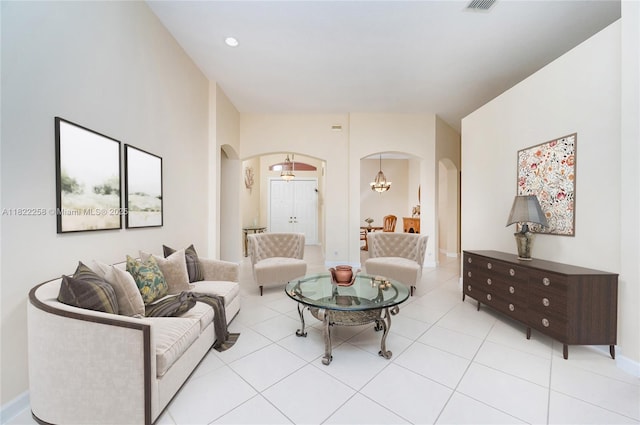 1001 SW 189th Ave, Pembroke Pines, FL 33029 - living room with arched walkways, a chandelier, and light tile patterned floors