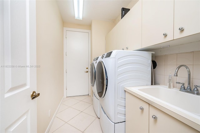 1001 SW 189th Ave, Pembroke Pines, FL 33029 - laundry area with washing machine and clothes dryer, cabinet space, and light tile patterned flooring