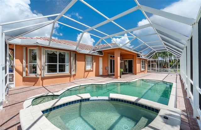 1001 SW 189th Ave, Pembroke Pines, FL 33029 - view of swimming pool featuring a pool with connected hot tub and a patio