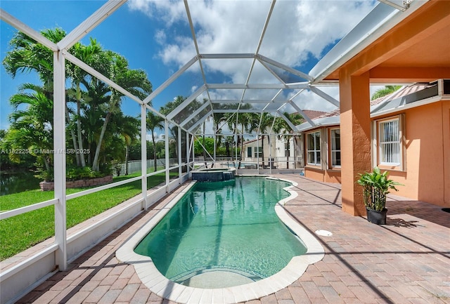 1001 SW 189th Ave, Pembroke Pines, FL 33029 - view of swimming pool with a patio area, a pool with connected hot tub, glass enclosure, and a yard