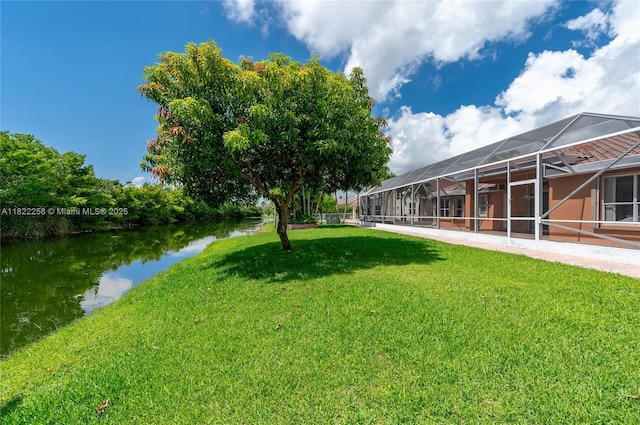 1001 SW 189th Ave, Pembroke Pines, FL 33029 - view of grassy yard with glass enclosure and a water view