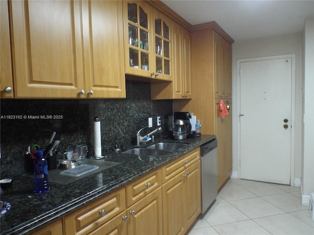 1890 S Ocean Dr Unit 504, Hallandale Beach, FL 33009 - kitchen featuring dishwasher, backsplash, dark stone countertops, light tile patterned flooring, and glass insert cabinets