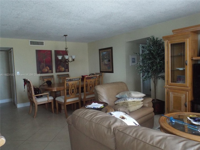 1890 S Ocean Dr Unit 504, Hallandale Beach, FL 33009 - living room with a chandelier, a textured ceiling, and light tile patterned floors