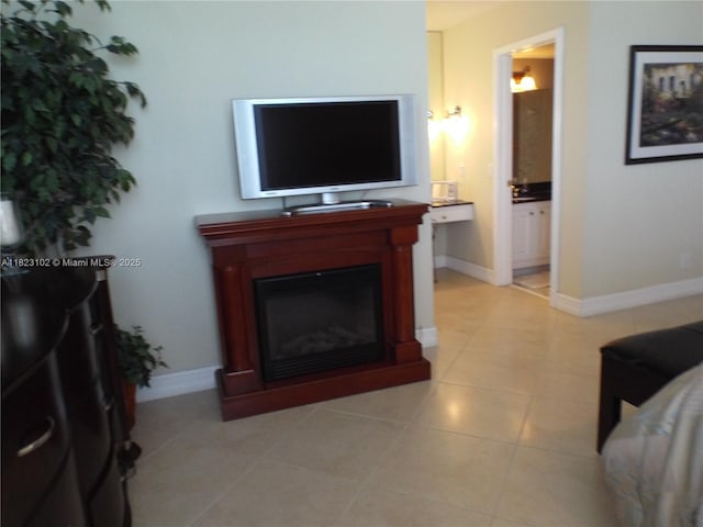 1890 S Ocean Dr Unit 504, Hallandale Beach, FL 33009 - living area featuring a glass covered fireplace and light tile patterned floors