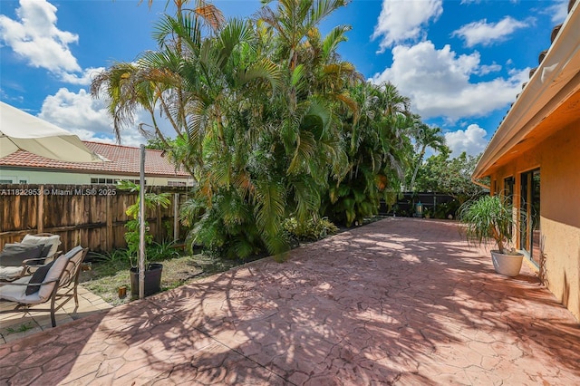 20045 NW 65th Ct, Hialeah, FL 33015 - fenced backyard with a patio area