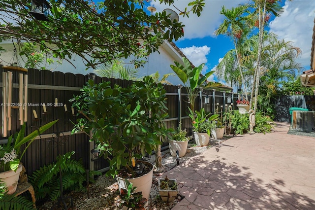 20045 NW 65th Ct, Hialeah, FL 33015 - fenced backyard featuring a patio area