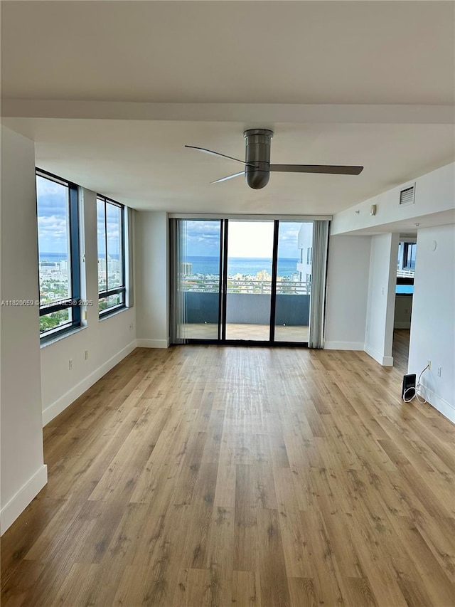1330 W Ave Unit 3007, Miami Beach, FL 33139 - unfurnished room featuring a ceiling fan and wood finished floors