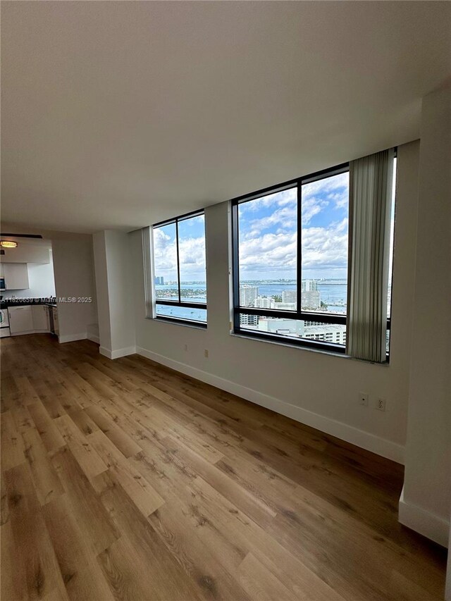 1330 W Ave Unit 3007, Miami Beach, FL 33139 - unfurnished living room featuring wood finished floors