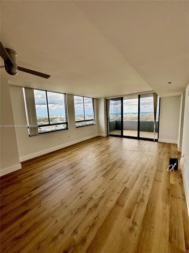 1330 W Ave Unit 3007, Miami Beach, FL 33139 - unfurnished room with wood finished floors and a ceiling fan