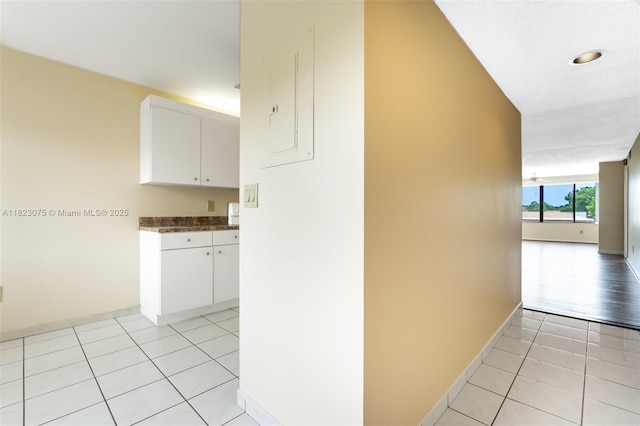 9455 N Belfort Cir Unit 211, Tamarac, FL 33321 - corridor featuring baseboards and light tile patterned floors
