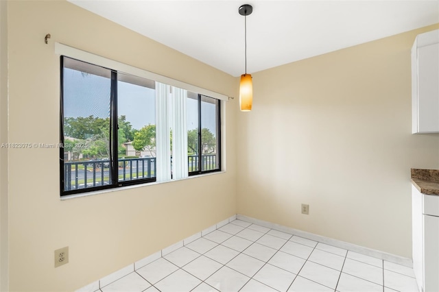 9455 N Belfort Cir Unit 211, Tamarac, FL 33321 - unfurnished dining area featuring baseboards