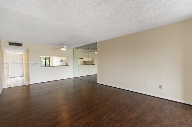 9455 N Belfort Cir Unit 211, Tamarac, FL 33321 - unfurnished living room featuring a ceiling fan, wood finished floors, and a textured ceiling