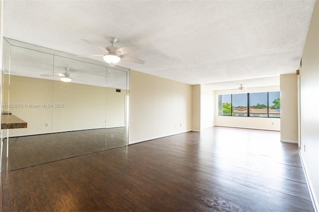 9455 N Belfort Cir Unit 211, Tamarac, FL 33321 - unfurnished living room with wood finished floors, a textured ceiling, and a ceiling fan