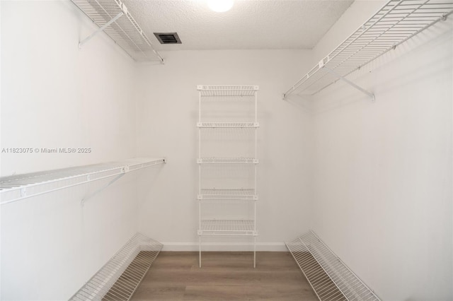 9455 N Belfort Cir Unit 211, Tamarac, FL 33321 - spacious closet with wood finished floors