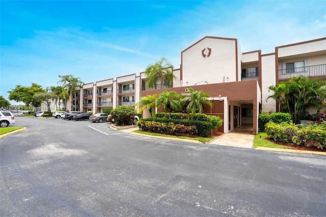 9455 N Belfort Cir Unit 211, Tamarac, FL 33321 - view of property featuring uncovered parking