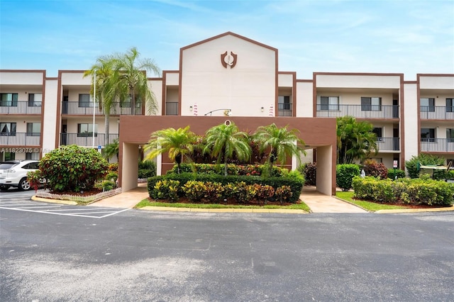 9455 N Belfort Cir Unit 211, Tamarac, FL 33321 - view of apartment building / complex with uncovered parking