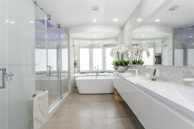 1331 97th St, Bay Harbor Islands, FL 33154 - full bathroom featuring a marble finish shower, double vanity, a freestanding tub, finished concrete floors, and recessed lighting