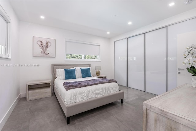 1331 97th St, Bay Harbor Islands, FL 33154 - bedroom with finished concrete floors, recessed lighting, and a closet